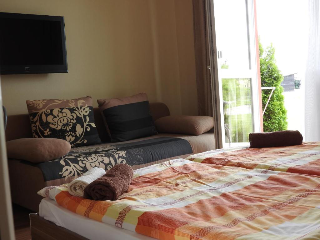 Postel nebo postele na pokoji v ubytování Fridrich apartman