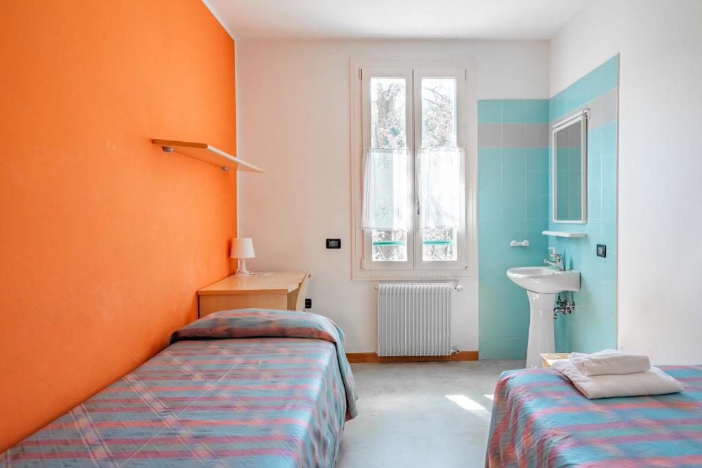 Letto o letti in una camera di Ostello Bassano Del Grappa