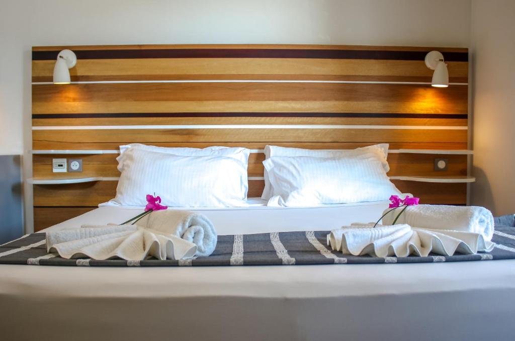 Ein Bett oder Betten in einem Zimmer der Unterkunft Le Battant Des Lames