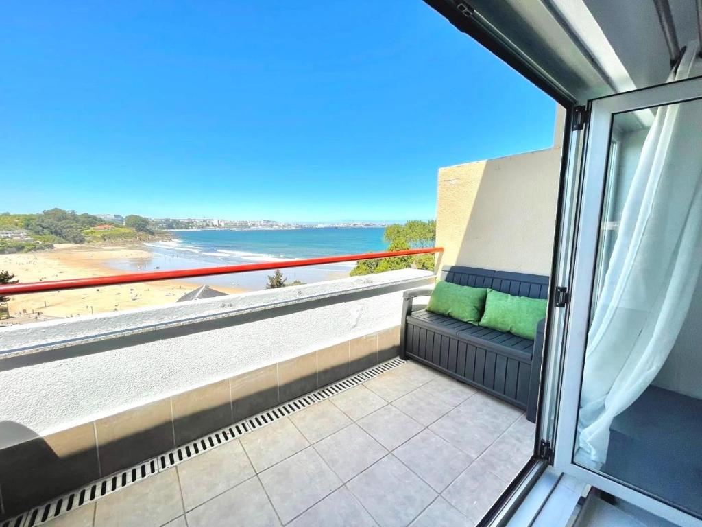 a balcony with a view of the beach at housingcoruña BASTIAGUEIRO in Bastiagueiro