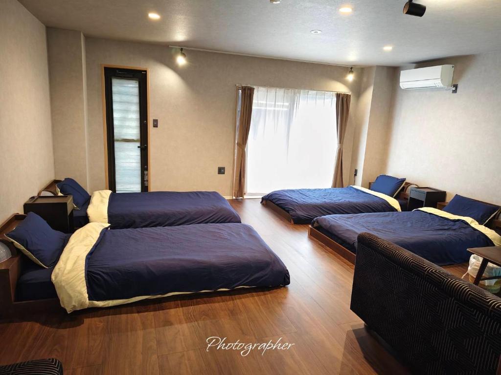 Postel nebo postele na pokoji v ubytování Guest House WA