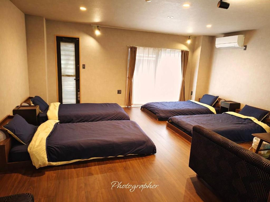 Postel nebo postele na pokoji v ubytování Guest House WA