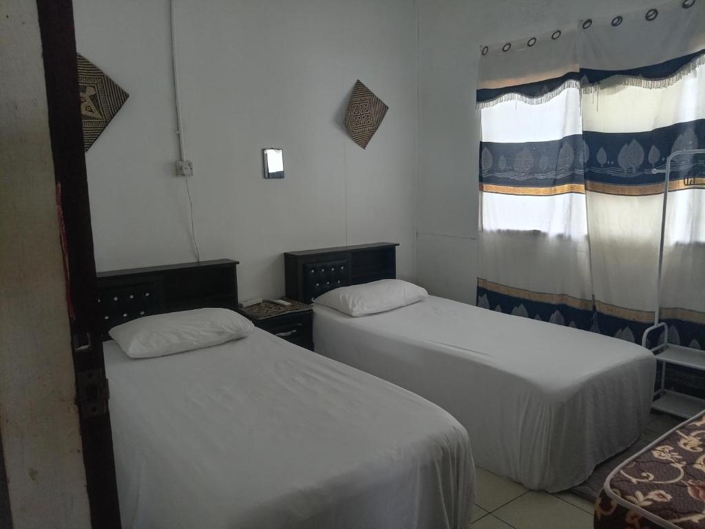 Postel nebo postele na pokoji v ubytování Mulu D Cave Homestay Room 2