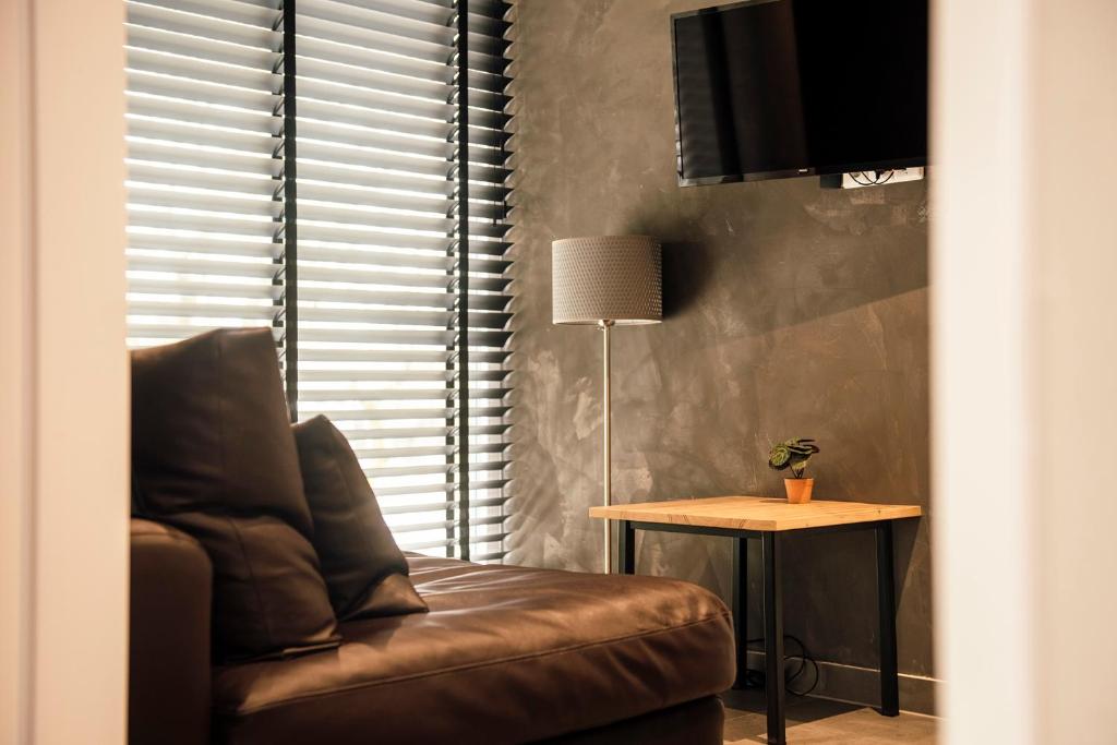 Posezení v ubytování Hotel de Kastanjefabriek