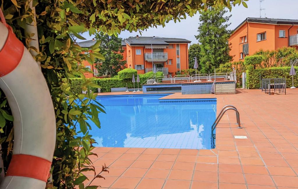 a swimming pool in front of a building at Casa Carla in Peschiera del Garda