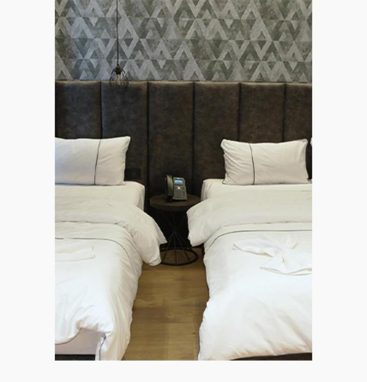 Letto o letti in una camera di StarLight Hotel