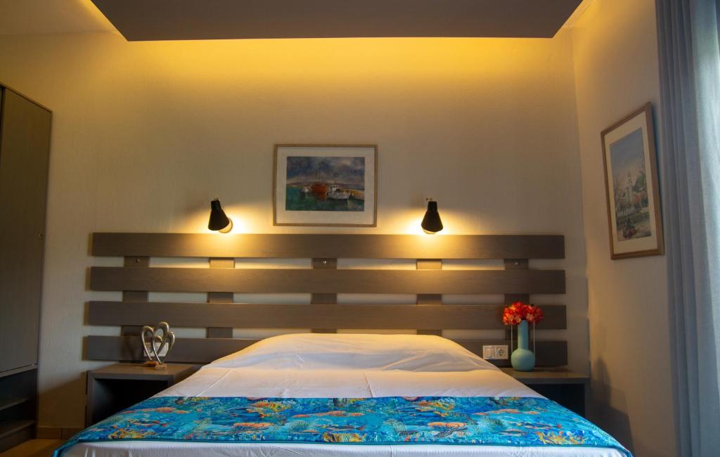 Posteľ alebo postele v izbe v ubytovaní Aliston Hotel Thassos