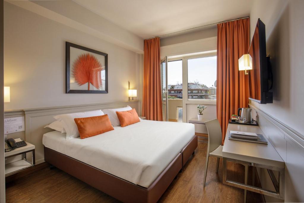 Postel nebo postele na pokoji v ubytování Grand Hotel Fleming by OMNIA hotels