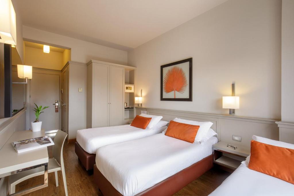 Postel nebo postele na pokoji v ubytování Grand Hotel Fleming by OMNIA hotels