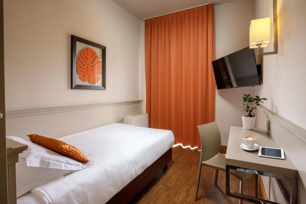 TV a/nebo společenská místnost v ubytování Grand Hotel Fleming by OMNIA hotels