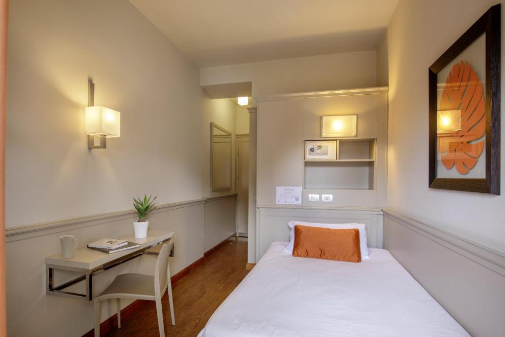 Postel nebo postele na pokoji v ubytování Grand Hotel Fleming by OMNIA hotels