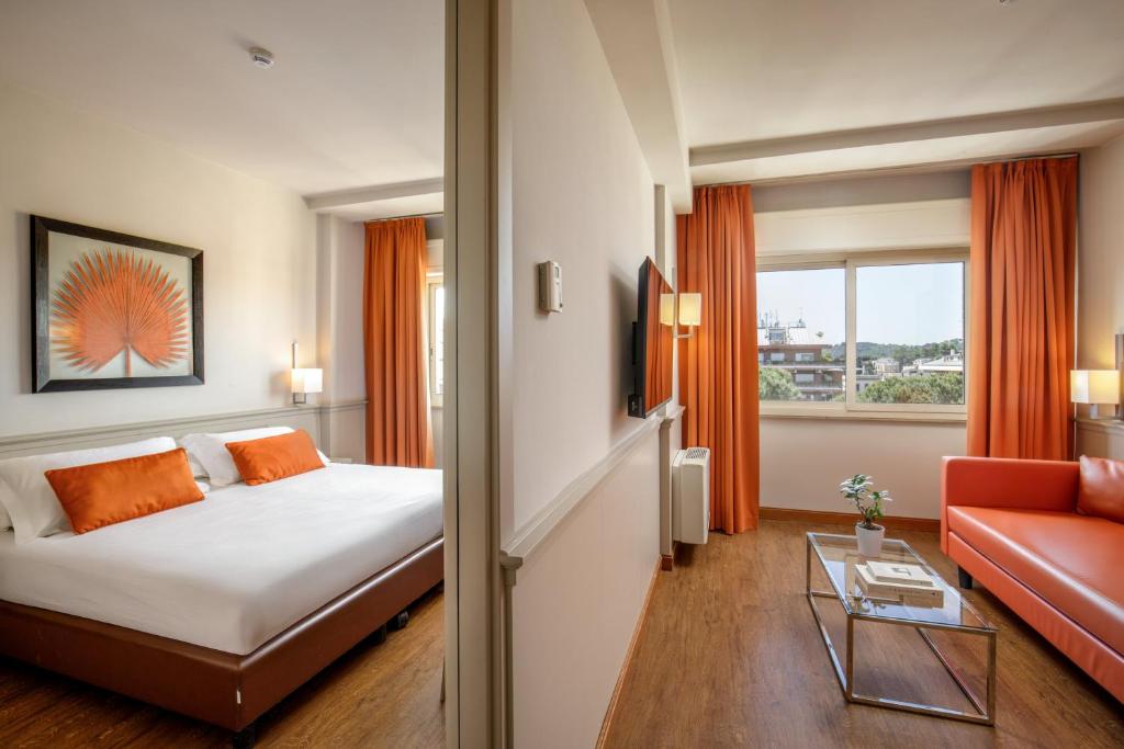 Postel nebo postele na pokoji v ubytování Grand Hotel Fleming by OMNIA hotels