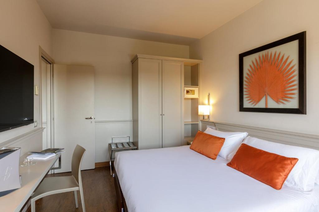 Postel nebo postele na pokoji v ubytování Grand Hotel Fleming by OMNIA hotels