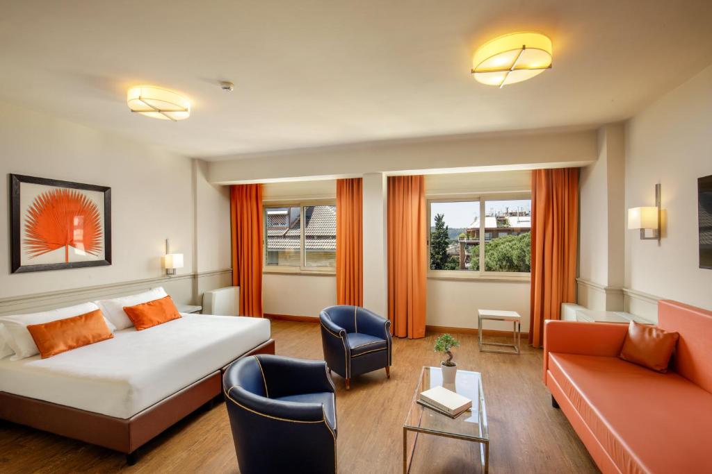 Postel nebo postele na pokoji v ubytování Grand Hotel Fleming by OMNIA hotels