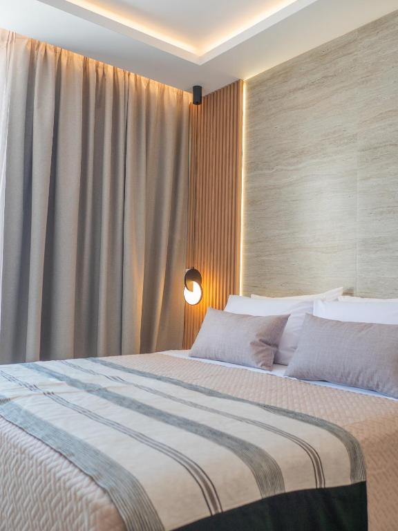 Postel nebo postele na pokoji v ubytování Poseidon Hotel