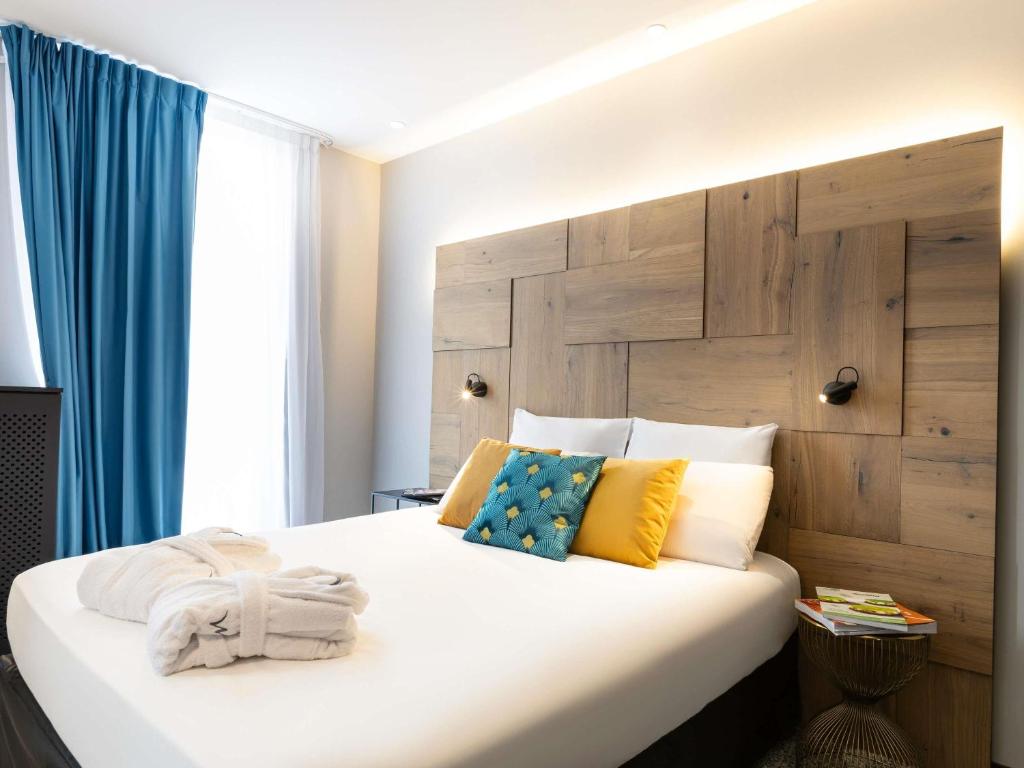 Postel nebo postele na pokoji v ubytování Mercure Epinal Centre