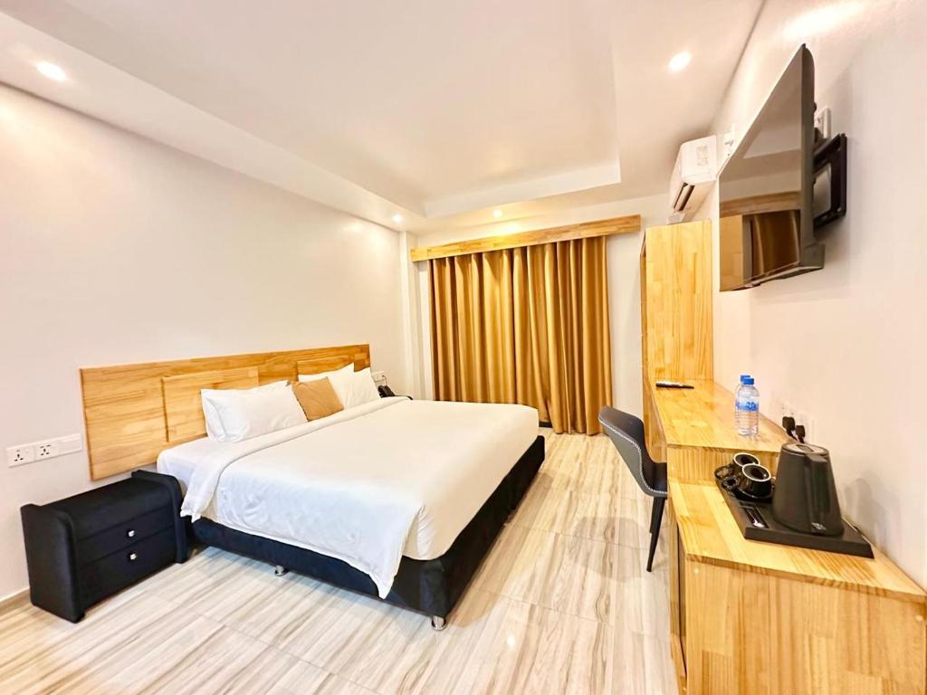 Postel nebo postele na pokoji v ubytování AIMI Beach Hotel