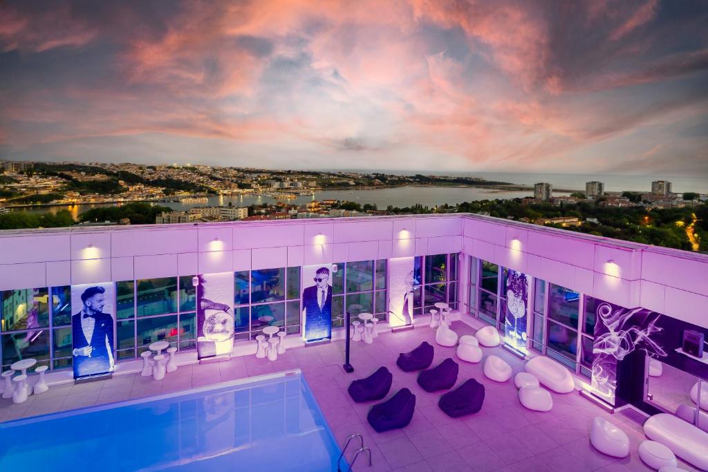 a building with a swimming pool on top of it at HF Ipanema Park in Porto