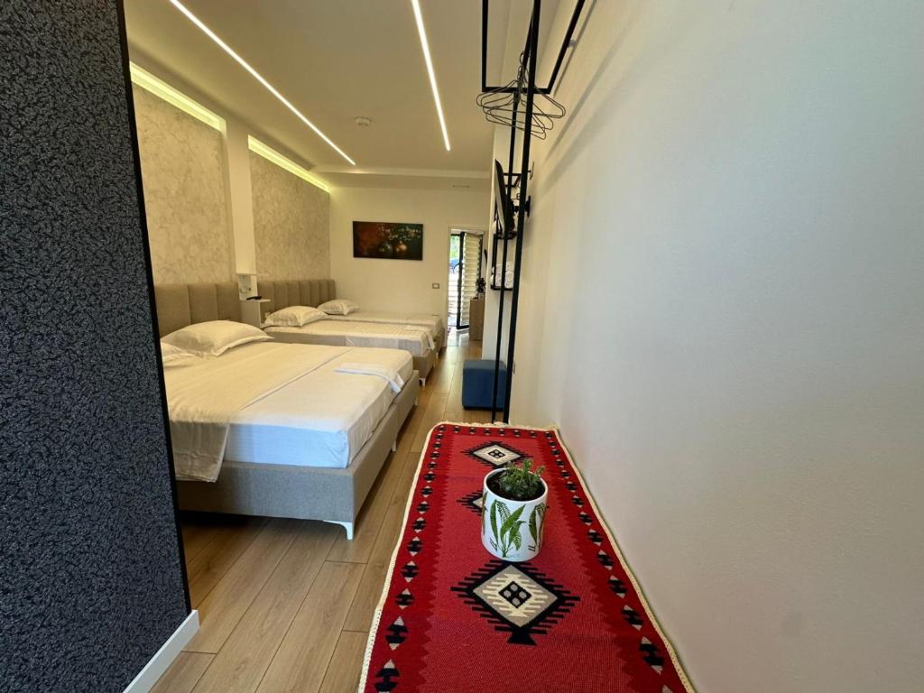 Postel nebo postele na pokoji v ubytování Hotel Europa Kruje