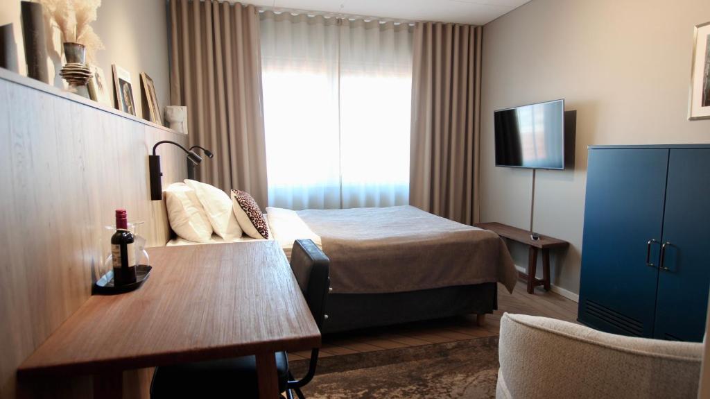 Postel nebo postele na pokoji v ubytování Best Western Plus John Bauer Hotel