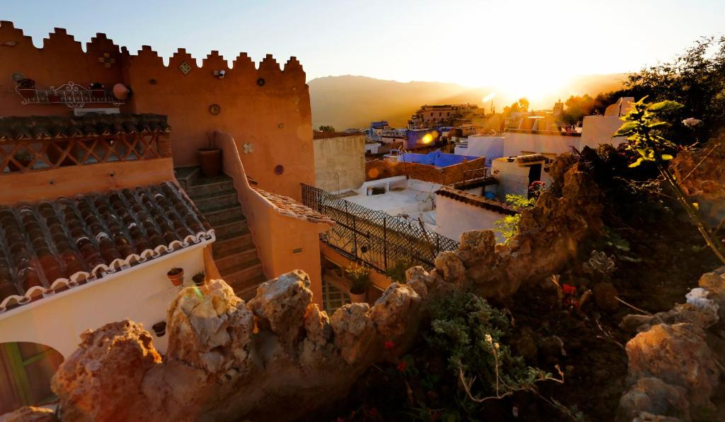 an aerial view of a city with a castle at Riad Cherifa in Chefchaouene