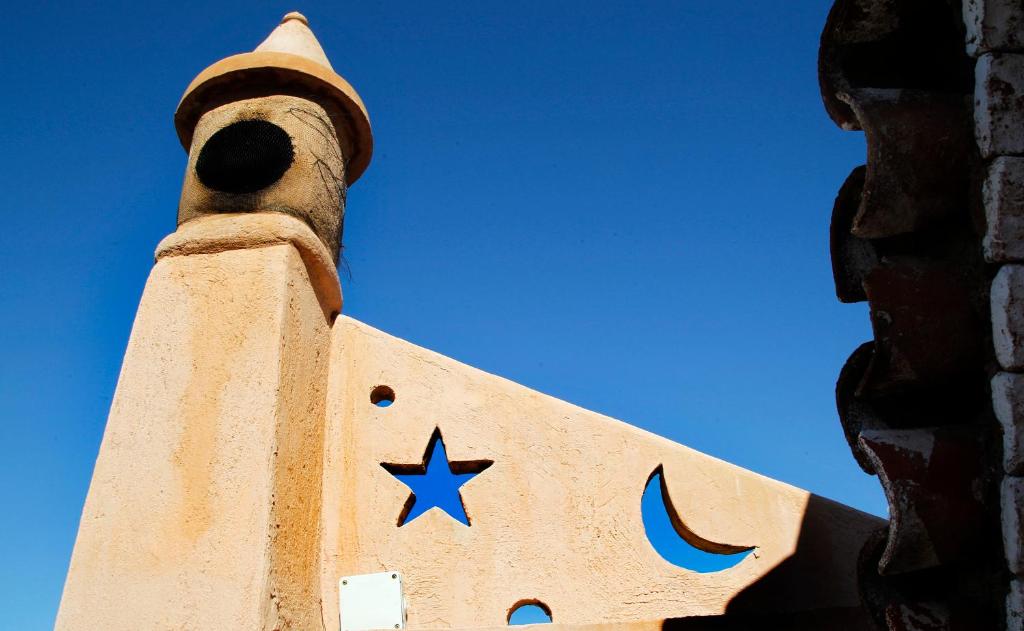 a building with a star on the top of it at Riad Cherifa in Chefchaouene