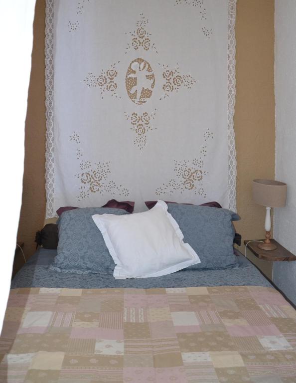 Postel nebo postele na pokoji v ubytování Le Petit Couvent