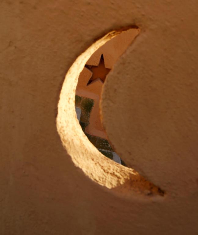 a crescent moon with a star in the middle at Riad Cherifa in Chefchaouene