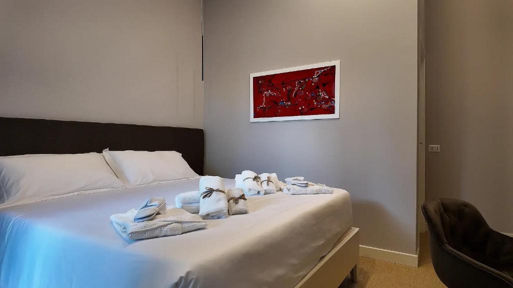 Postel nebo postele na pokoji v ubytování Amelié Lago d’Orta Hotel