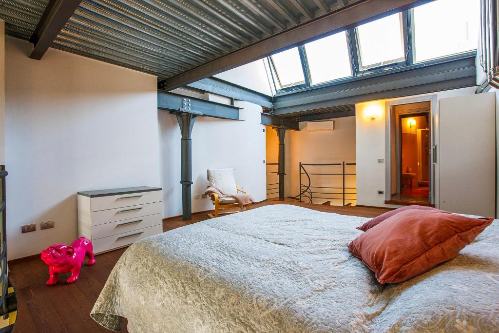 Postel nebo postele na pokoji v ubytování La Filanda: Loft