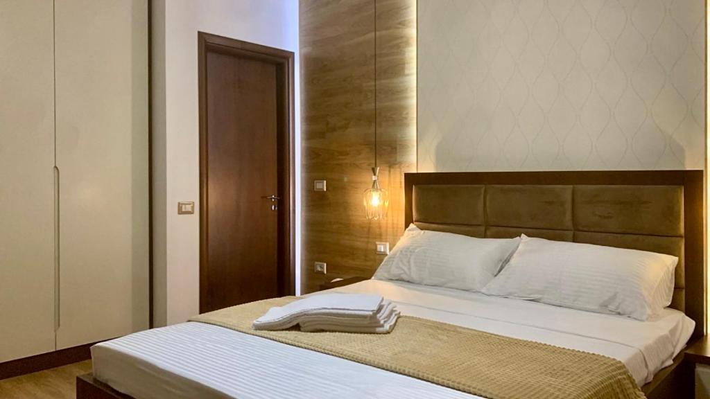 Postel nebo postele na pokoji v ubytování Triena Rooms