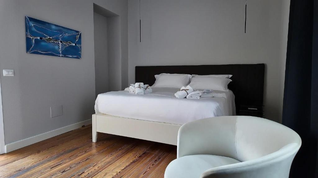 Postel nebo postele na pokoji v ubytování Amelié Lago d’Orta Hotel