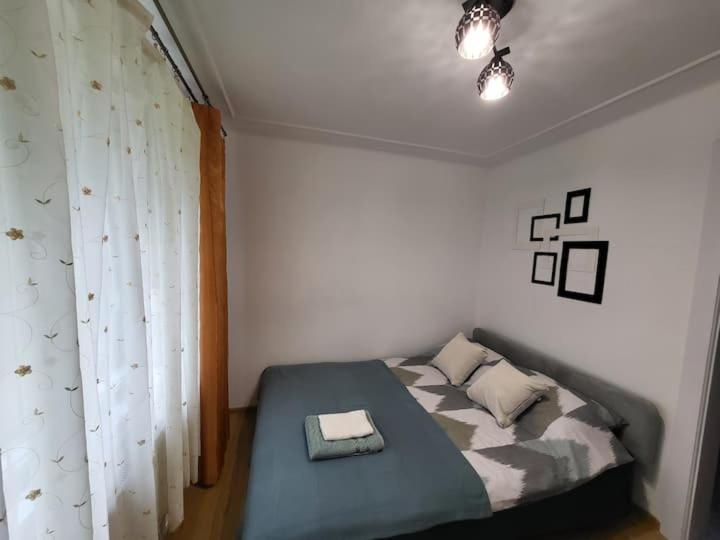 Postel nebo postele na pokoji v ubytování Tulipan Hotel Aquapark