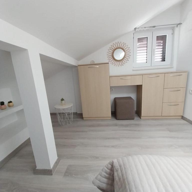 Postel nebo postele na pokoji v ubytování Apartments Zlata