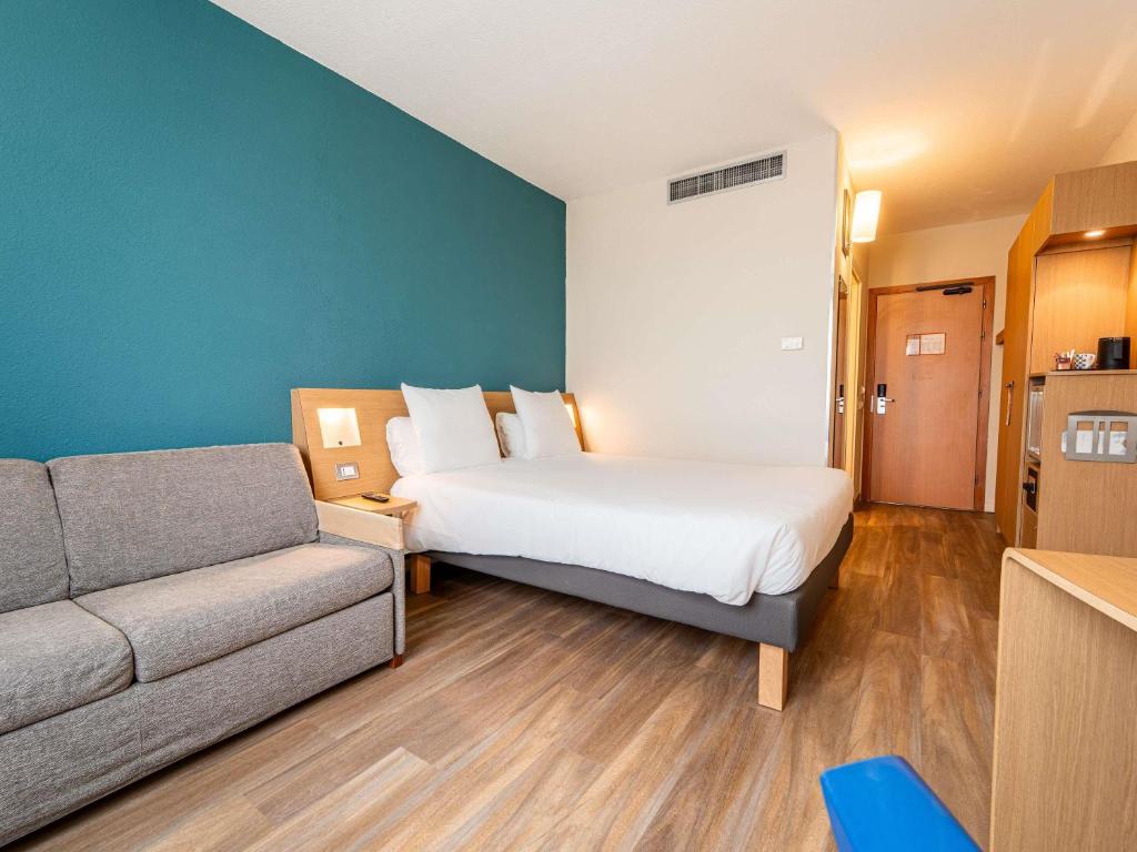 Postel nebo postele na pokoji v ubytování Novotel Roma Est