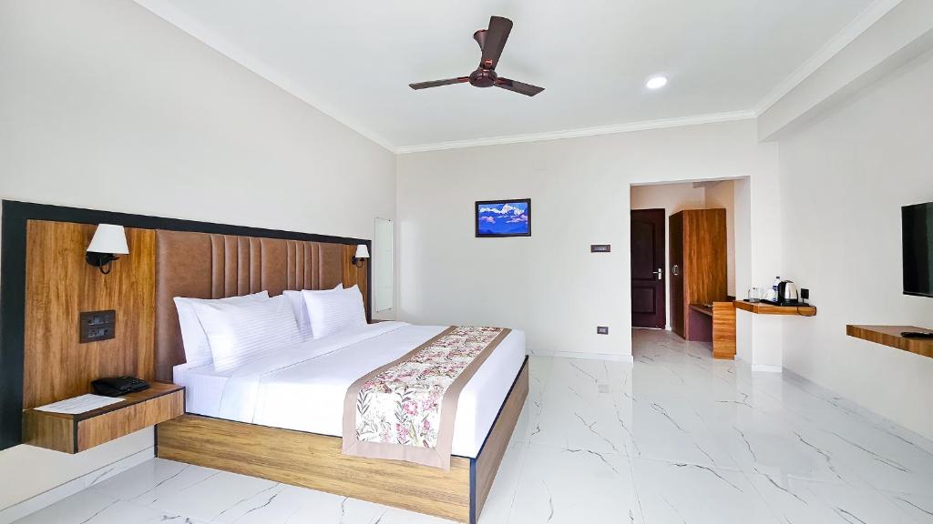 Postel nebo postele na pokoji v ubytování Yashshree Resorts & Spa Kalimpong
