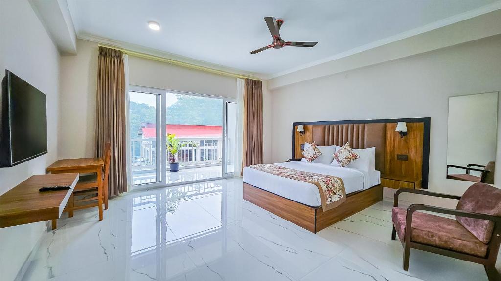 Postel nebo postele na pokoji v ubytování Yashshree Resorts & Spa Kalimpong