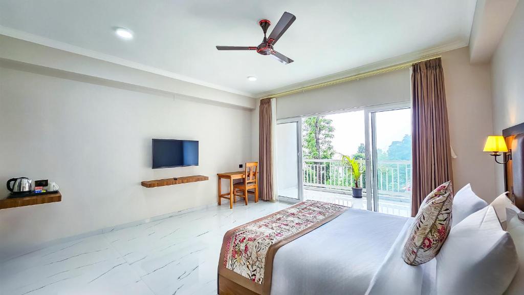 TV a/nebo společenská místnost v ubytování Yashshree Resorts & Spa Kalimpong