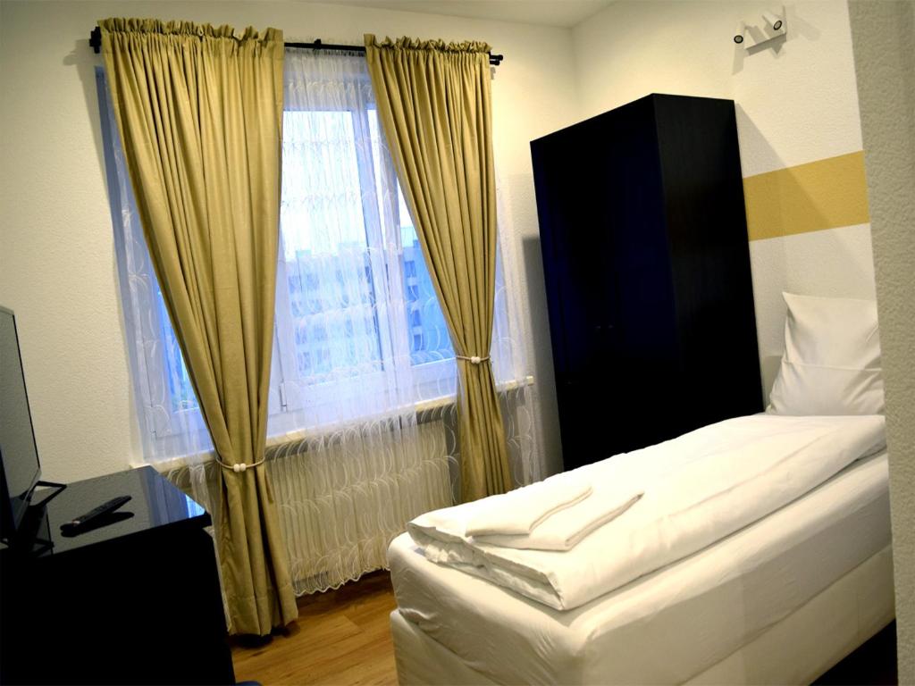 Postel nebo postele na pokoji v ubytování Hotel Restaurant Krebs