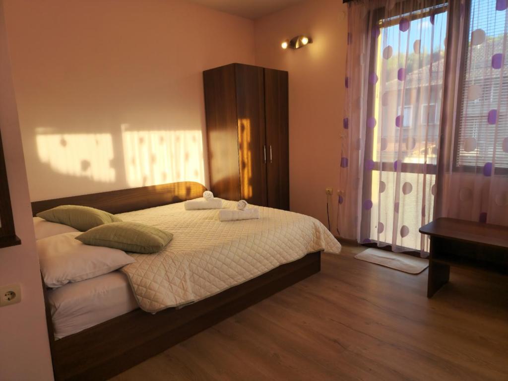 Postel nebo postele na pokoji v ubytování Rebeka Guest House