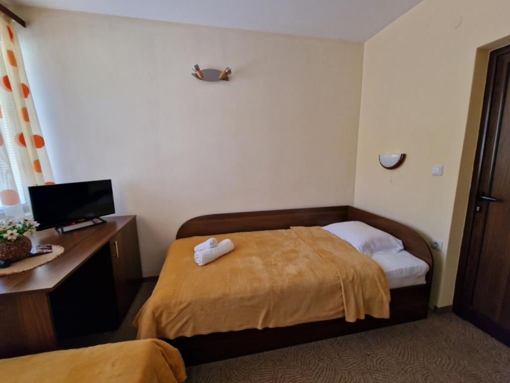 Postel nebo postele na pokoji v ubytování Rebeka Guest House