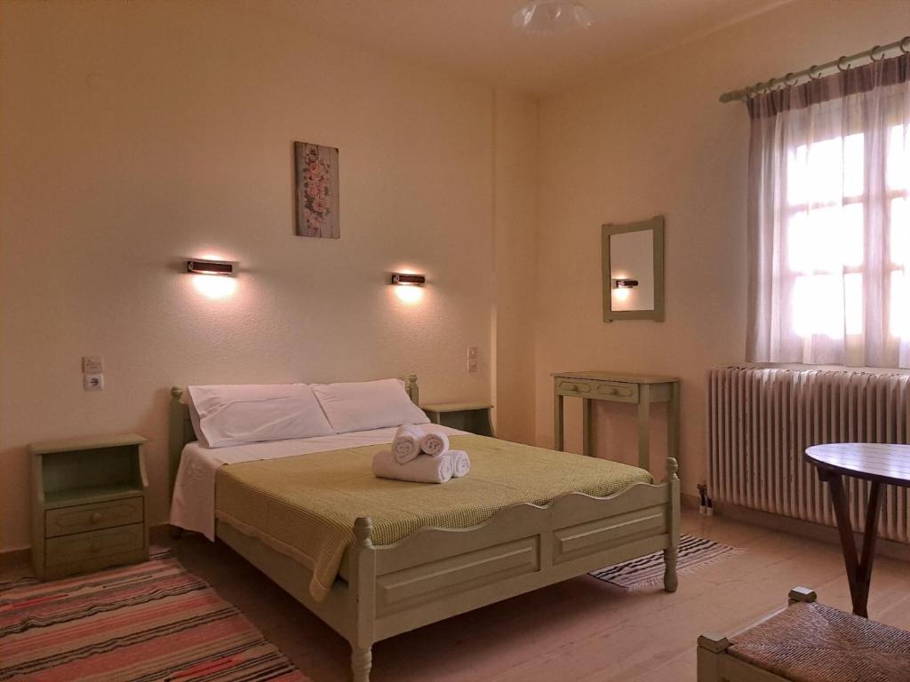 Postel nebo postele na pokoji v ubytování Olga Studios