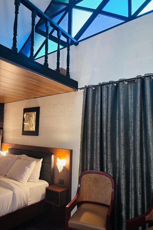 Postel nebo postele na pokoji v ubytování Ilocos Urban Wave Resort