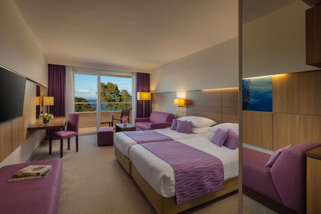 Postel nebo postele na pokoji v ubytování Vitality Hotel Punta