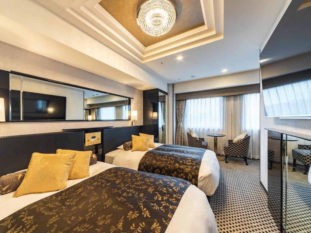 Postel nebo postele na pokoji v ubytování APA Hotel Akihabara Ekihigashi