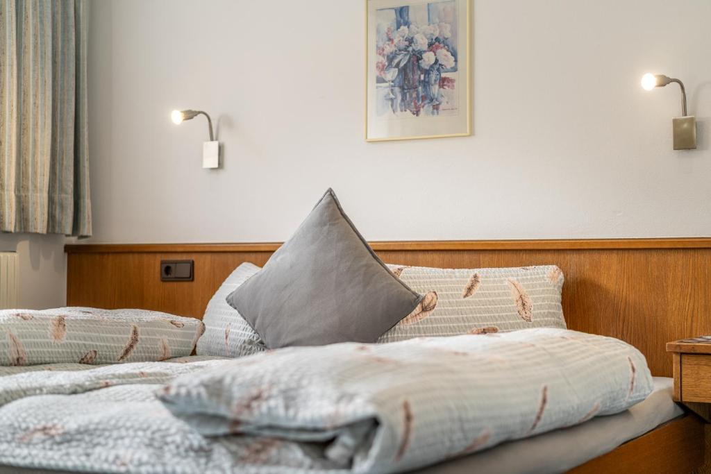 Posteľ alebo postele v izbe v ubytovaní Gästehaus Raphaela