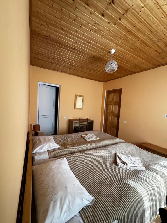 Postel nebo postele na pokoji v ubytování Guest House Victor