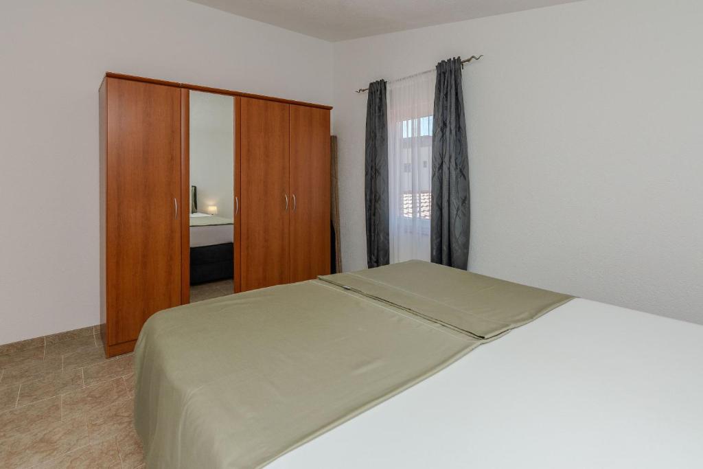 Posteľ alebo postele v izbe v ubytovaní Apartments Tukara
