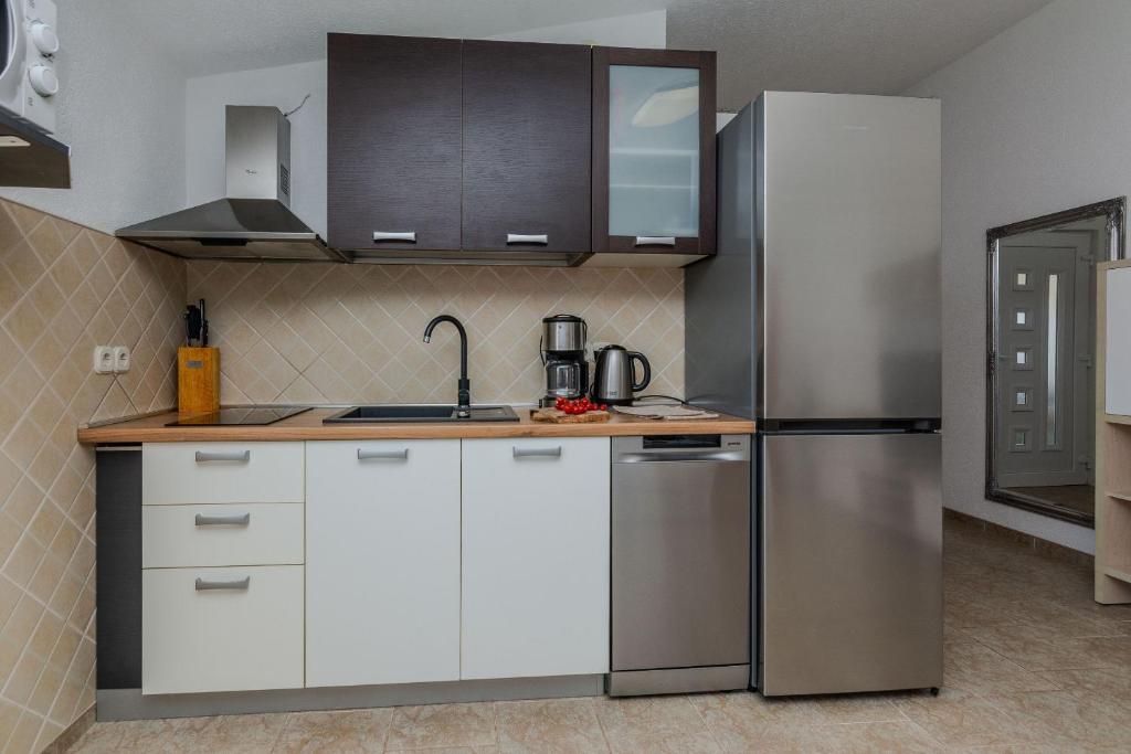 Kuchyňa alebo kuchynka v ubytovaní Apartments Tukara