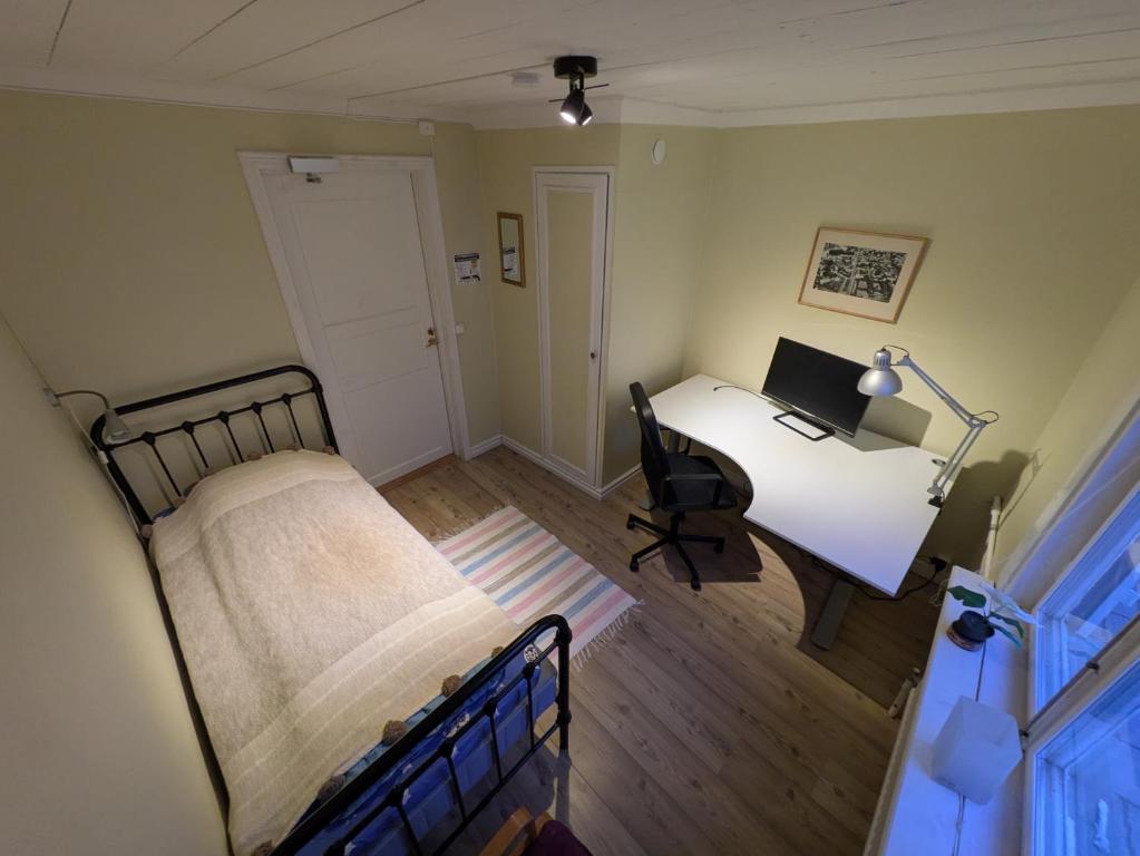 Postel nebo postele na pokoji v ubytování Hostel Räntmästaregården